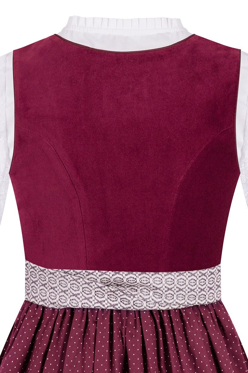 Elegantes Dirndl mit bordeauxfarbenem Mieder und gepunktetem Rock von MOSER Trachten.