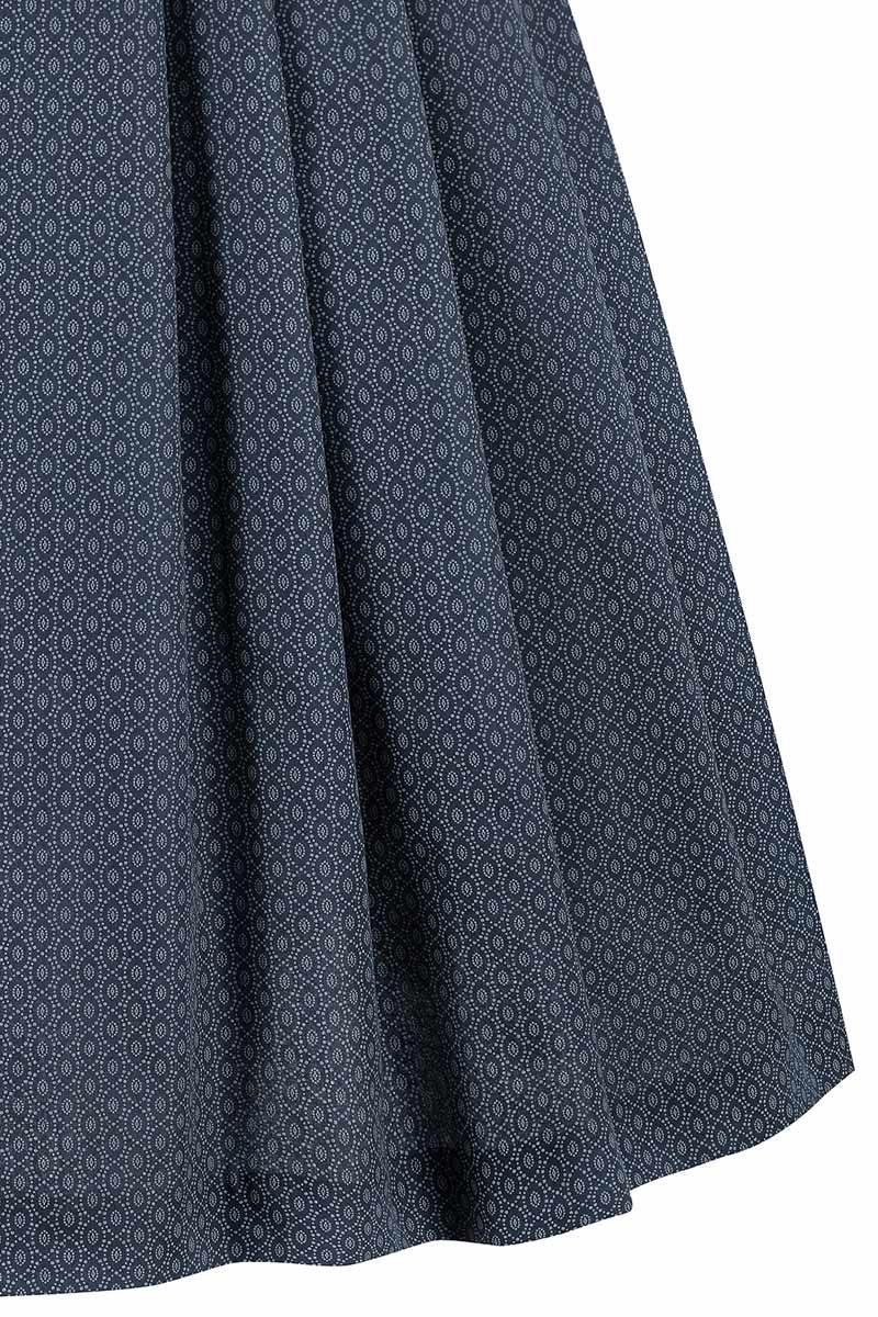 Moderner Trachtenrock von MOSER Trachten mit elegantem Muster auf dunkelblauem Grund.