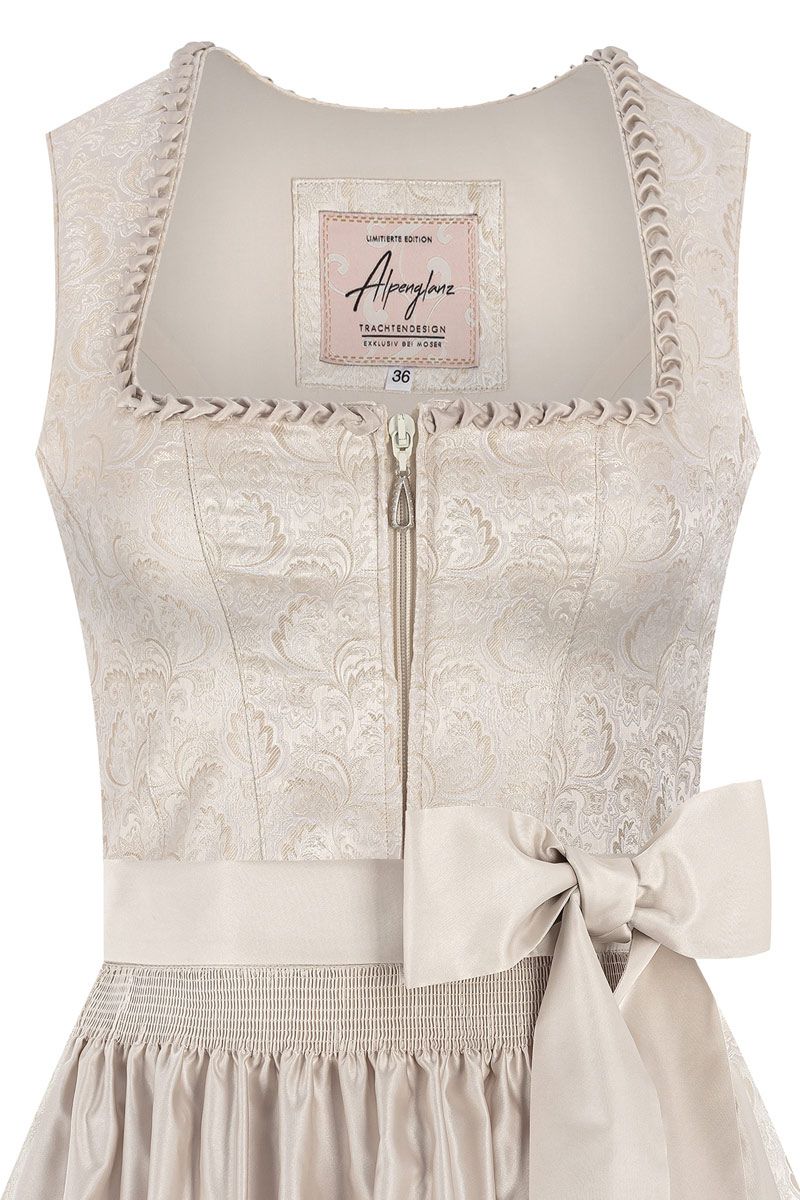 Elegantes Dirndl Mieder in Creme mit Stickerei und Schleife, exklusiv von MOSER Trachten.