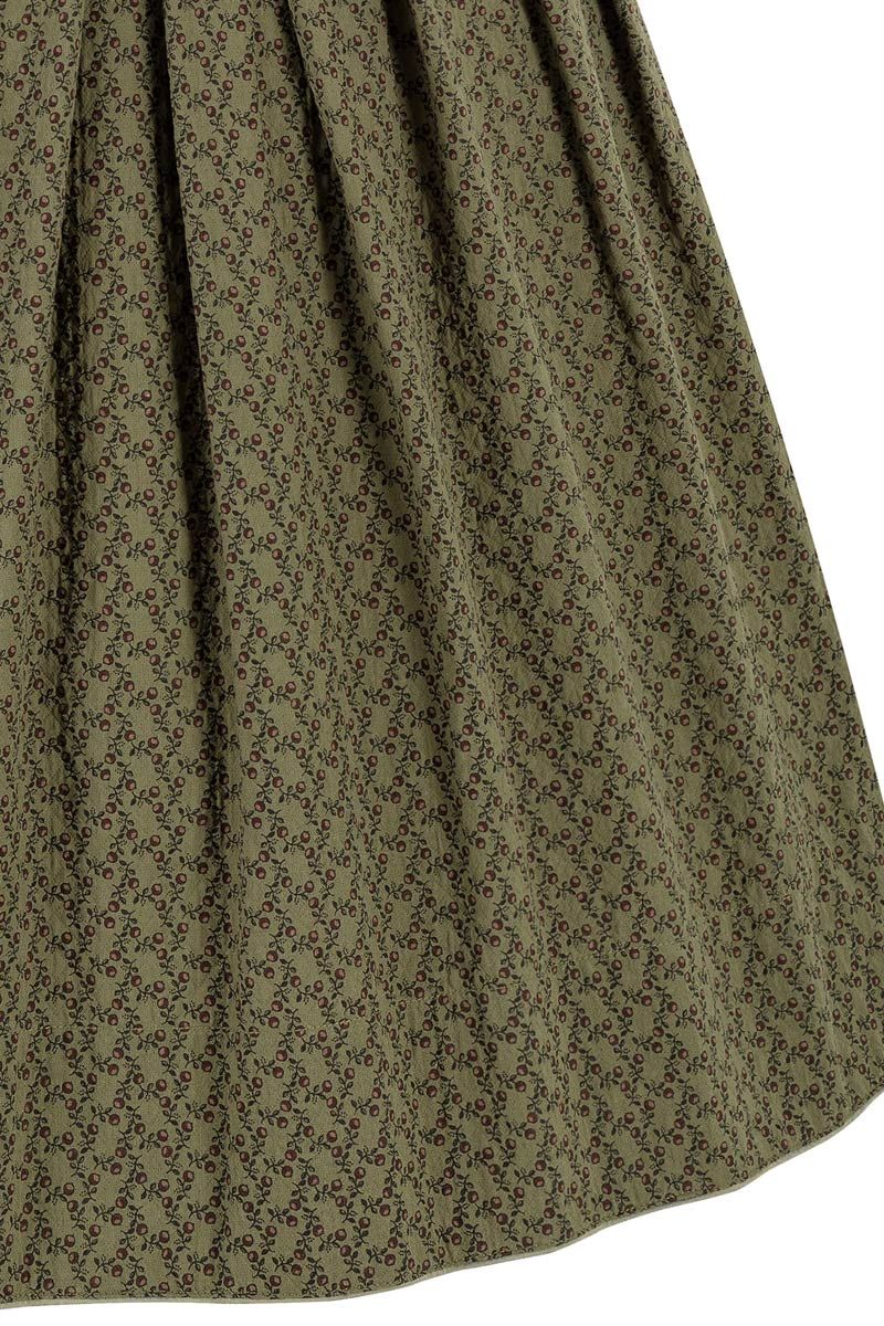 Olivegrüner Dirndlrock mit feinem Blumenmuster von MOSER Trachten.