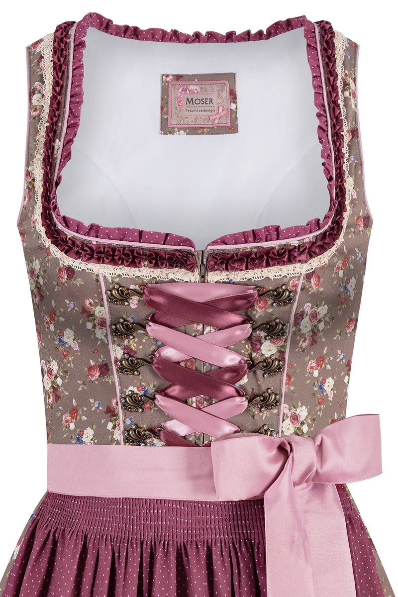 Elegantes rosafarbenes Dirndl mit floralen Mustern von MOSER Trachten.