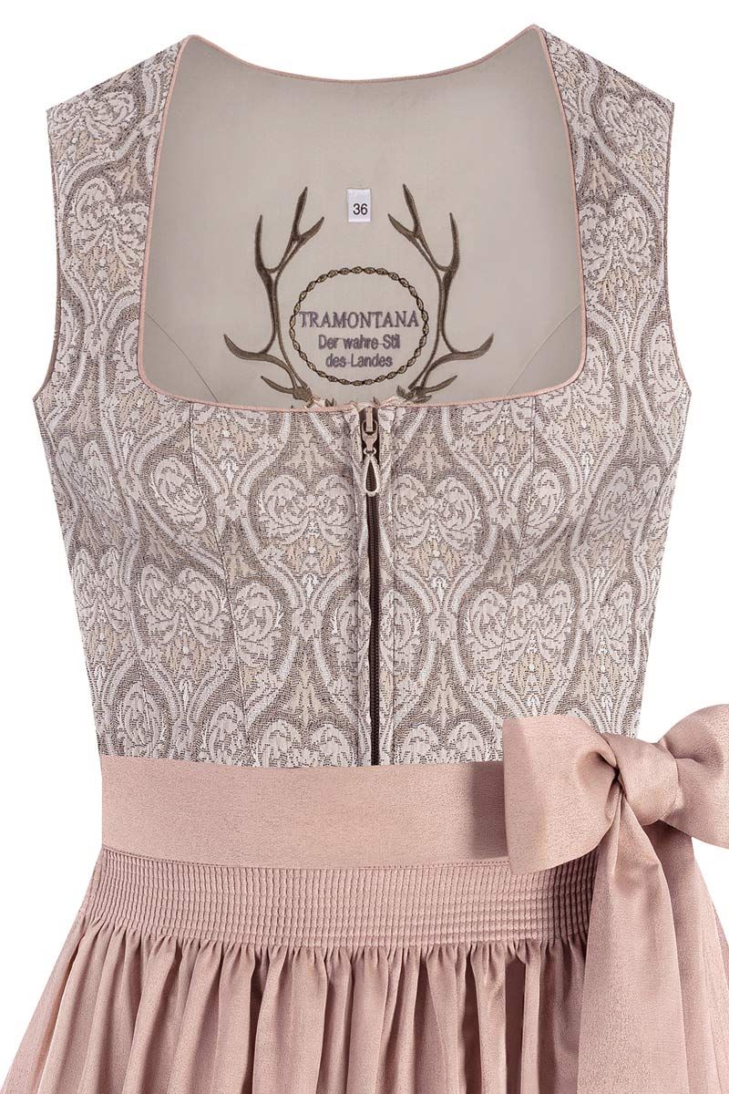 Elegantes Mieder in beige mit feinem Muster und Schleife von MOSER Trachten.