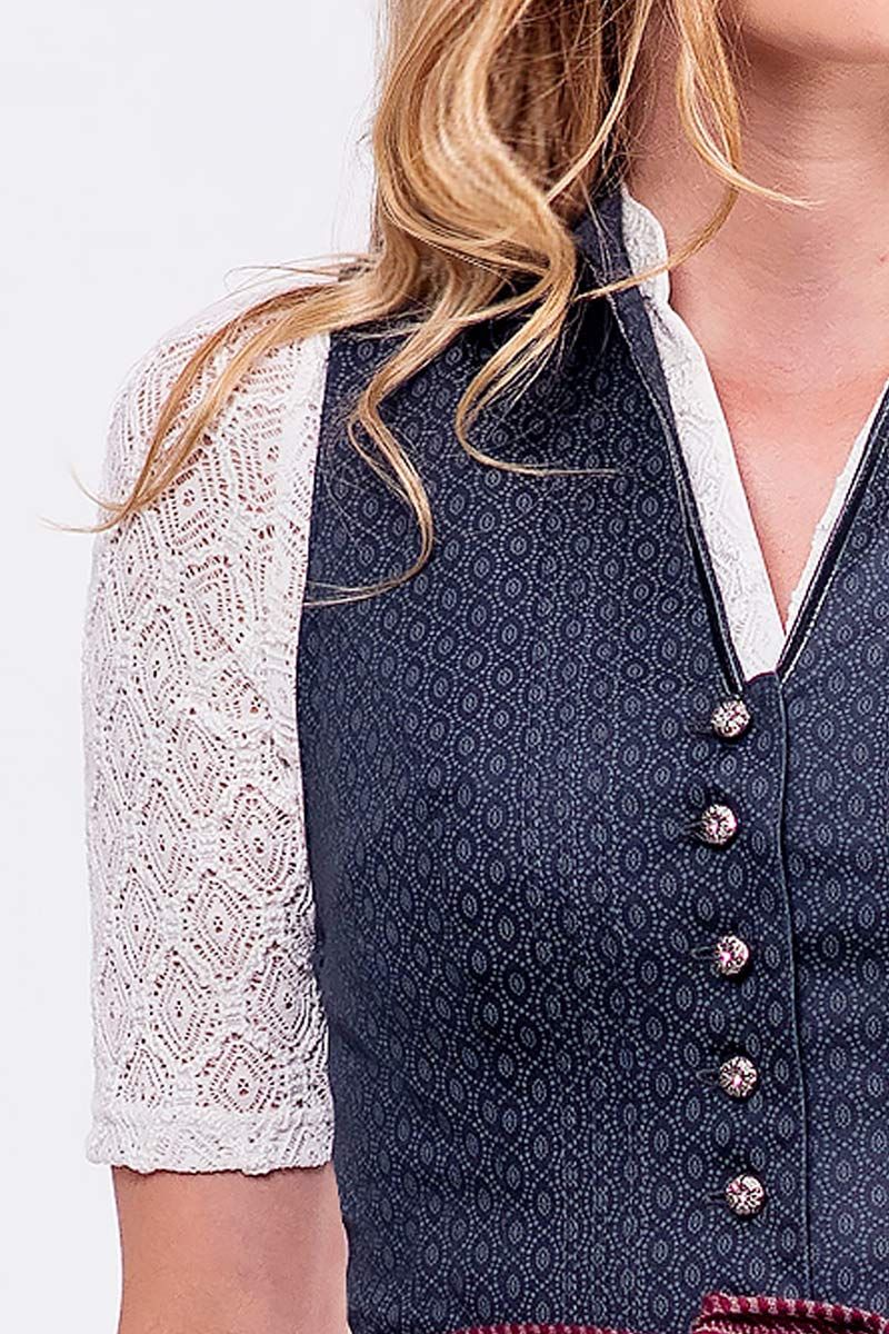 Blaues Mieder mit eleganter Knopfleiste von MOSER Trachten, kombiniert mit weißer Spitzentunika.